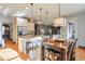 Spacious kitchen with white cabinets, granite countertops, and stainless steel appliances at 1103 Ridenour Ct, Kennesaw, GA 30152