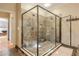 Large walk-in shower with pebble floor and multi-head shower system at 1103 Ridenour Ct, Kennesaw, GA 30152