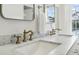 Bathroom features marble countertop and gold fixtures at 15 Independence Nw Pl, Atlanta, GA 30318