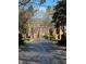 Tree-lined entrance to a charming community of brick townhouses at 15 Independence Nw Pl, Atlanta, GA 30318