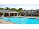 Inviting community pool with lounge chairs and brick building at 15 Independence Nw Pl, Atlanta, GA 30318