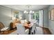 Elegant dining room with a wood table, six chairs, and wainscoting at 15 Independence Nw Pl, Atlanta, GA 30318