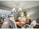 Formal dining room with wood floors and view into the living room at 15 Independence Nw Pl, Atlanta, GA 30318