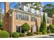 Two-story brick home with dormer windows and manicured landscaping at 15 Independence Nw Pl, Atlanta, GA 30318