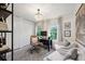 Home office with built-in shelving and seating area at 15 Independence Nw Pl, Atlanta, GA 30318