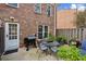 Brick patio with table, chairs and grill at 15 Independence Nw Pl, Atlanta, GA 30318