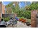 Cozy patio with seating, grill, and herb garden at 15 Independence Nw Pl, Atlanta, GA 30318