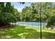 Well-maintained tennis courts nestled in a wooded area at 15 Independence Nw Pl, Atlanta, GA 30318