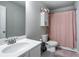 Bathroom with shower/tub combo and white vanity at 150 Auburn Depot Dr, Auburn, GA 30011