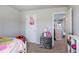 Bright bedroom featuring neutral walls, carpet, and a view into the connecting room at 150 Auburn Depot Dr, Auburn, GA 30011