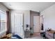 A neutral bedroom with a large window and carpeted floors, bathed in natural light at 150 Auburn Depot Dr, Auburn, GA 30011