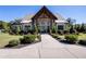 Beautifully designed community clubhouse with stone accents, elegant entrance, and manicured landscaping at 150 Auburn Depot Dr, Auburn, GA 30011