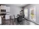 Bright dining area with gray chairs and access to backyard at 150 Auburn Depot Dr, Auburn, GA 30011