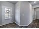 Bright entryway with dark gray flooring and a white door at 150 Auburn Depot Dr, Auburn, GA 30011