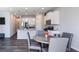 The dining area flows seamlessly into a well-equipped kitchen with white cabinetry at 150 Auburn Depot Dr, Auburn, GA 30011