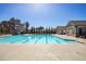 Large community swimming pool with a water slide on a sunny day at 150 Auburn Depot Dr, Auburn, GA 30011