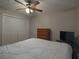 Primary bedroom with ceiling fan and built-in closet at 2710 Se Cumberland Court, Smyrna, GA 30080