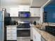 Well-equipped kitchen featuring stainless steel appliances and granite countertops at 2710 Se Cumberland Court, Smyrna, GA 30080