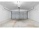 Large empty garage with overhead door at 2966 Knollberry Ln, Decatur, GA 30034