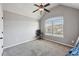 Bright bedroom with vaulted ceiling, ceiling fan, and window at 527 Mossycup Dr, Fairburn, GA 30213