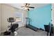 Charming bedroom with light blue accent wall and home gym at 527 Mossycup Dr, Fairburn, GA 30213