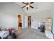 Bedroom with vaulted ceiling, ceiling fan and access to bathroom at 527 Mossycup Dr, Fairburn, GA 30213