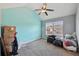 Bedroom with vaulted ceiling, ceiling fan and window at 527 Mossycup Dr, Fairburn, GA 30213