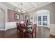 Bright dining room with hardwood floors and french doors at 527 Mossycup Dr, Fairburn, GA 30213