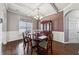 Formal dining room features a charming wooden table and hutch at 527 Mossycup Dr, Fairburn, GA 30213