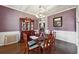 Spacious dining area with hardwood floors and decorative wall at 527 Mossycup Dr, Fairburn, GA 30213