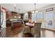 Eat-in kitchen boasts an island and stainless steel appliances at 527 Mossycup Dr, Fairburn, GA 30213