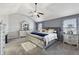 Main bedroom with high ceiling, ceiling fan, and large bed at 527 Mossycup Dr, Fairburn, GA 30213