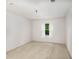 Spacious bedroom with window and neutral-colored carpet at 109 Ridley Howard Ct, Decatur, GA 30030