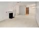 Living room with fireplace, neutral carpeting, and plenty of natural light at 109 Ridley Howard Ct, Decatur, GA 30030