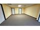 Large unfinished basement room with neutral walls and carpet at 170 Amicalola Way, Jonesboro, GA 30236