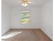 Bright bedroom with carpet flooring and a large window at 170 Amicalola Way, Jonesboro, GA 30236