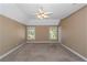 Spacious bedroom with neutral carpeting and ceiling fan at 170 Amicalola Way, Jonesboro, GA 30236