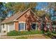 Brick house with a two car garage and mature trees at 170 Amicalola Way, Jonesboro, GA 30236