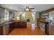 Modern kitchen with dark cabinets, granite counters, and stainless steel appliances at 170 Amicalola Way, Jonesboro, GA 30236