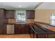 Modern kitchen with dark cabinets and granite countertops at 170 Amicalola Way, Jonesboro, GA 30236