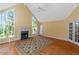 Bright living room with hardwood floors, vaulted ceilings, and a fireplace at 170 Amicalola Way, Jonesboro, GA 30236