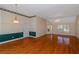 Large living room with hardwood floors and access to a deck at 170 Amicalola Way, Jonesboro, GA 30236