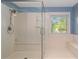 Large walk-in shower with built-in seat and glass enclosure at 170 Amicalola Way, Jonesboro, GA 30236