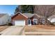 Red brick ranch house with a two-car garage and manicured lawn at 175 Robin Ct, Fayetteville, GA 30215