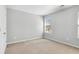 Well-lit bedroom with carpet and a window at 2297 Elmbridge Rd, Buford, GA 30519