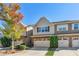 Two-story townhome with two-car garage and brick accents at 2297 Elmbridge Rd, Buford, GA 30519