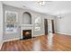 Living room with hardwood floors, fireplace, and sliding door to patio at 2297 Elmbridge Rd, Buford, GA 30519