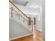 Elegant wooden staircase leading to upper level at 2297 Elmbridge Rd, Buford, GA 30519