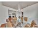 Bright dining room with glass table and chandelier, open to living area at 4334 Austin Farm Trl, Acworth, GA 30101