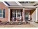 Front porch with rocking chairs, flower baskets, and landscaping at 4334 Austin Farm Trl, Acworth, GA 30101